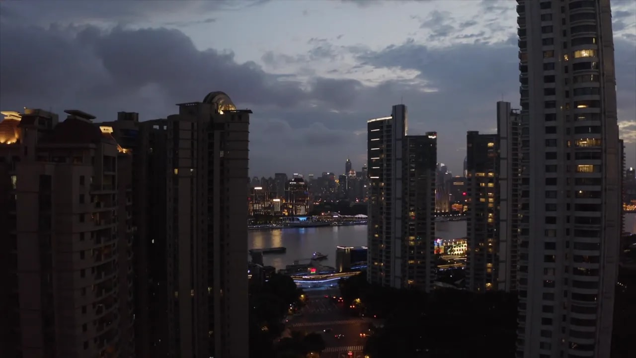 Dusk skyline with high-rise apartments and river view in Beijing