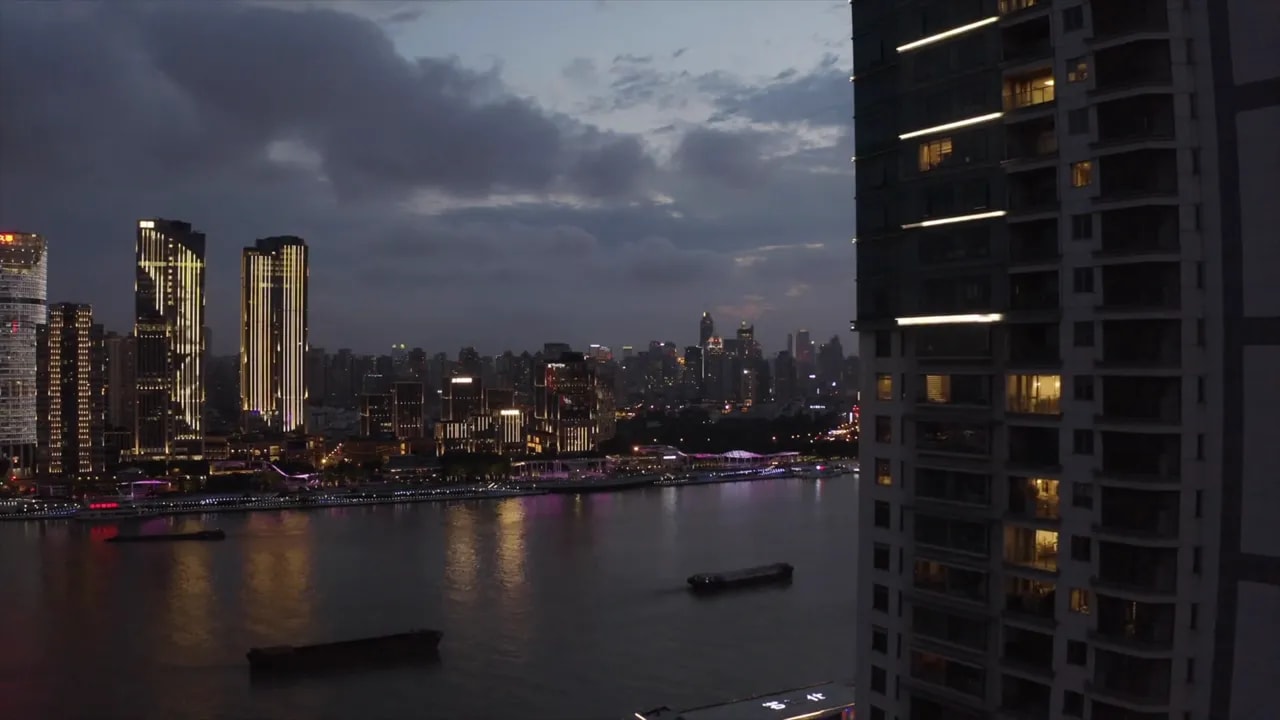 Beijing skyline over the river at dusk with illuminated high-rises