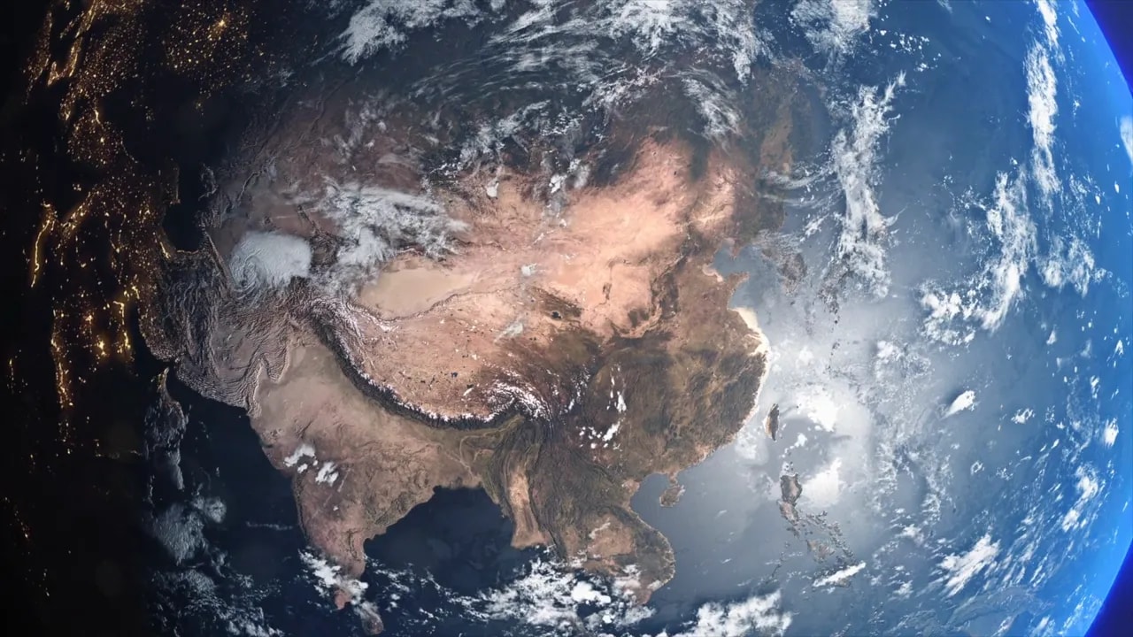 Earth from space with visible landmasses and nighttime city lights