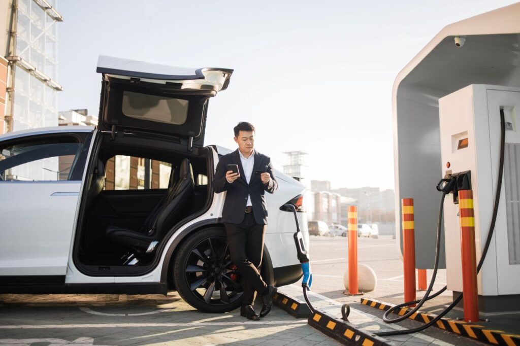 adult man charging electric car china s