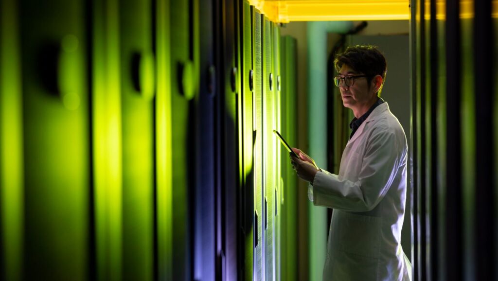 china technician using tablet in server room environment datacenter build out s