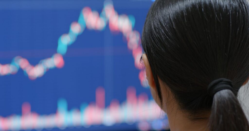 china woman watching the stock market graph s