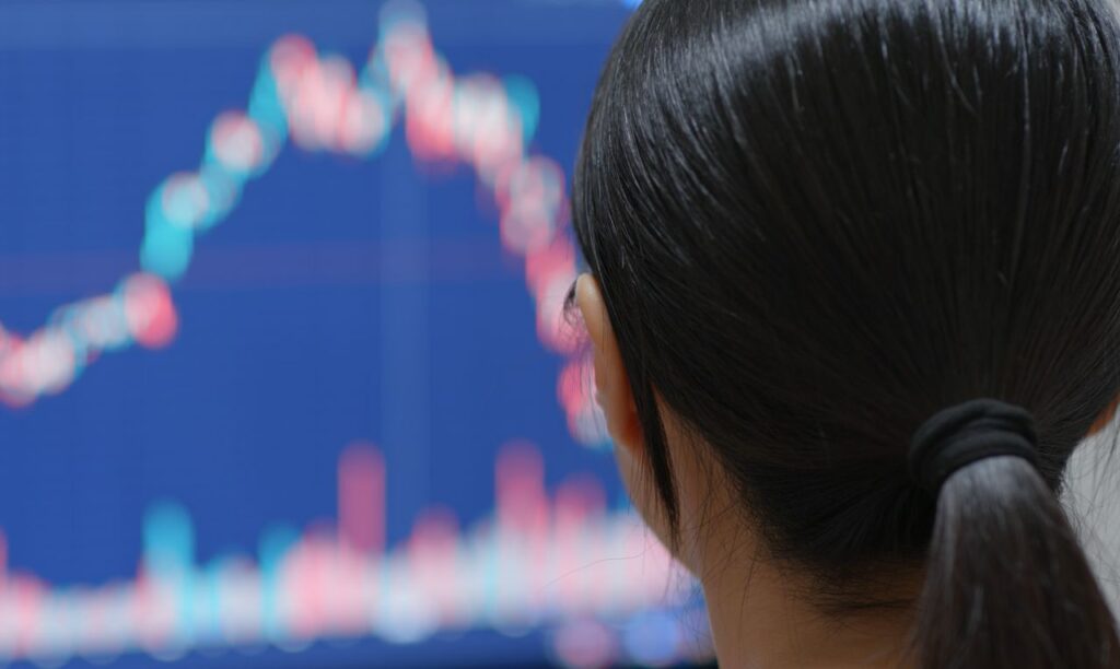 china woman watching the stock market graph s