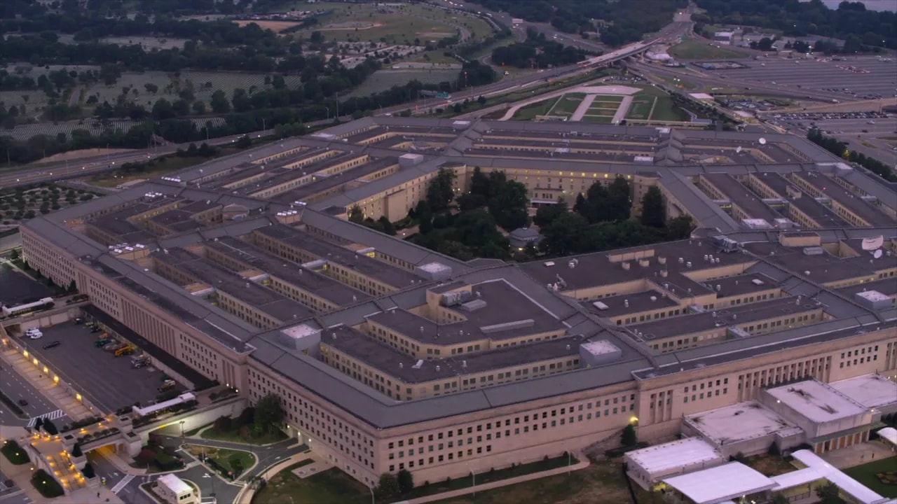 On-screen list of major Chinese technology firms including Alibaba Baidu BYD and Nio in Pentagon blacklist coverage