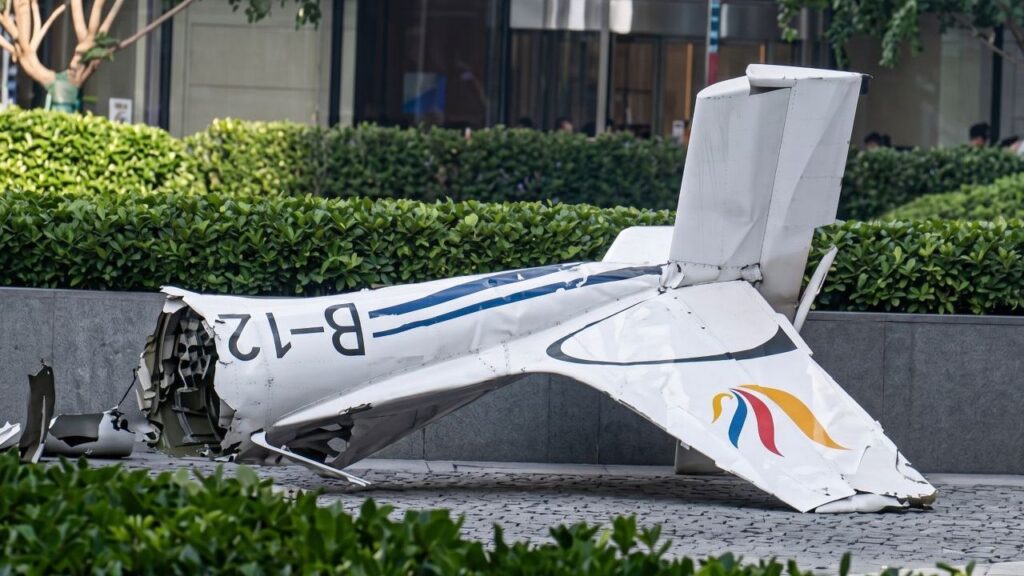 plane wreckage in beijing after hitting building