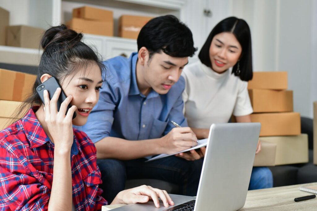 smiling young adults buying online s