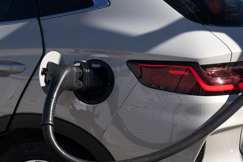 close up of electric car charging in broad daylight
