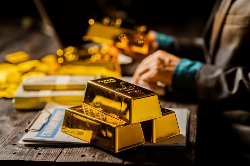 gold bullion on a wooden desk at night in hong kong