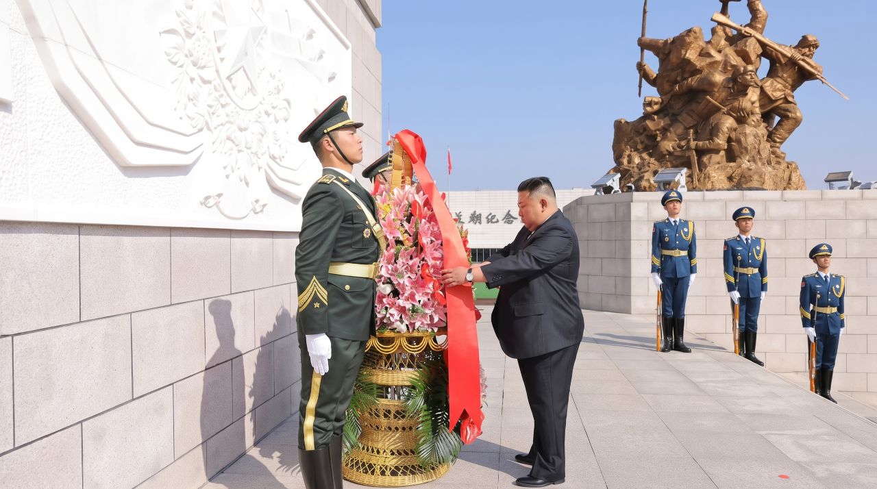 north korean leader kim jong un laying a ceremonial floral wreath during a visit to the memorial hall of the war